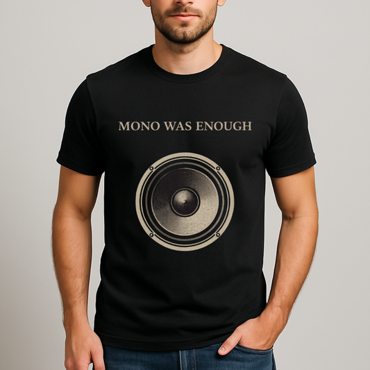 Male model wearing Mono Was Enough black graphic tee with large analog speaker print.