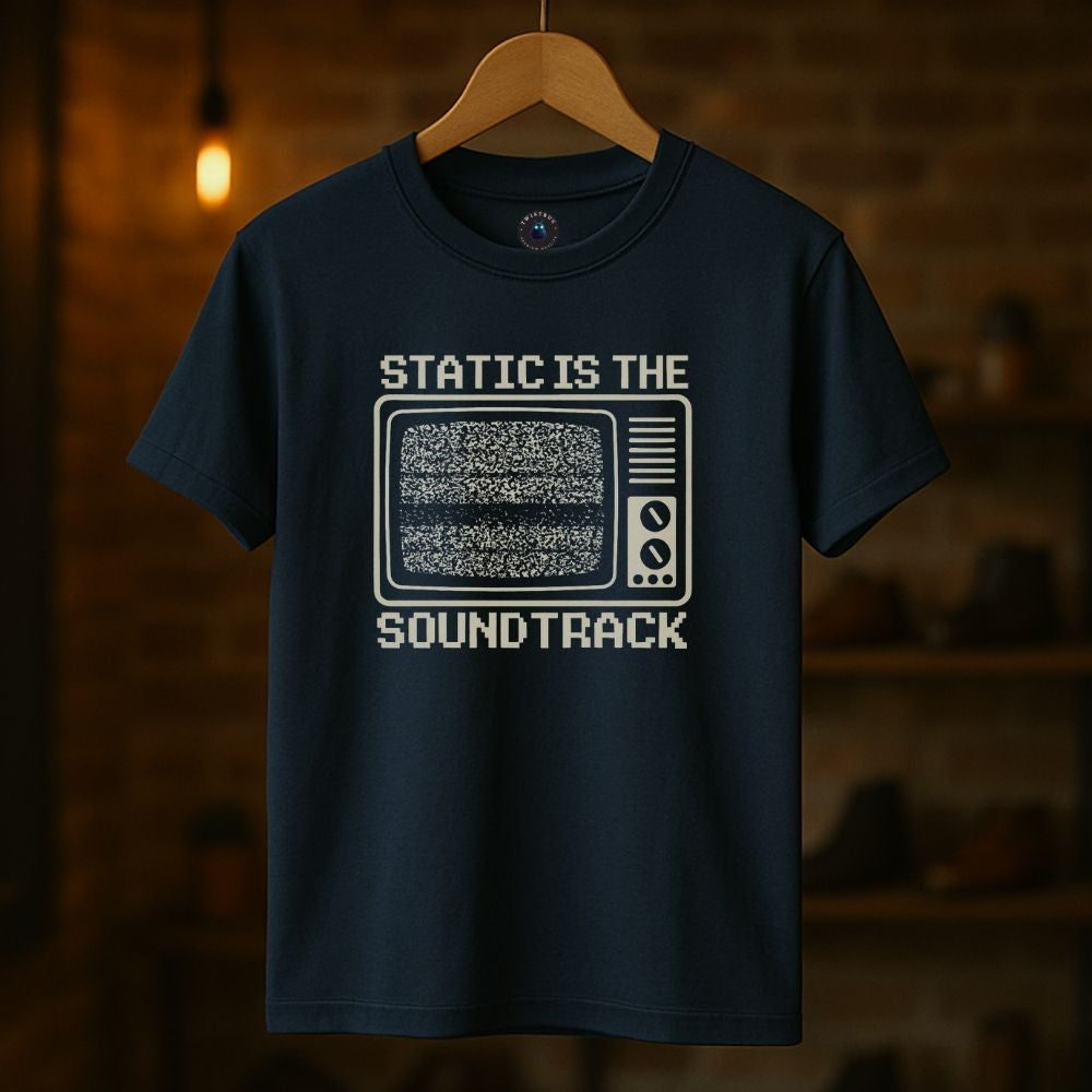 Navy graphic tee flat lay with cassette tape and vintage aesthetic