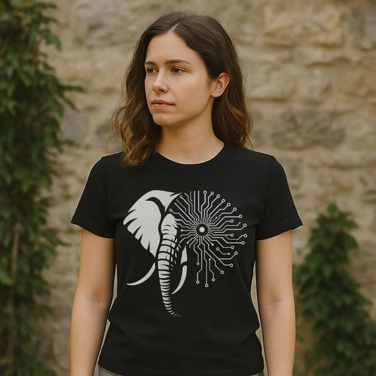 Woman wearing Twistbug black t-shirt featuring a half-elephant, half-circuit board design, outdoors by a stone wall.