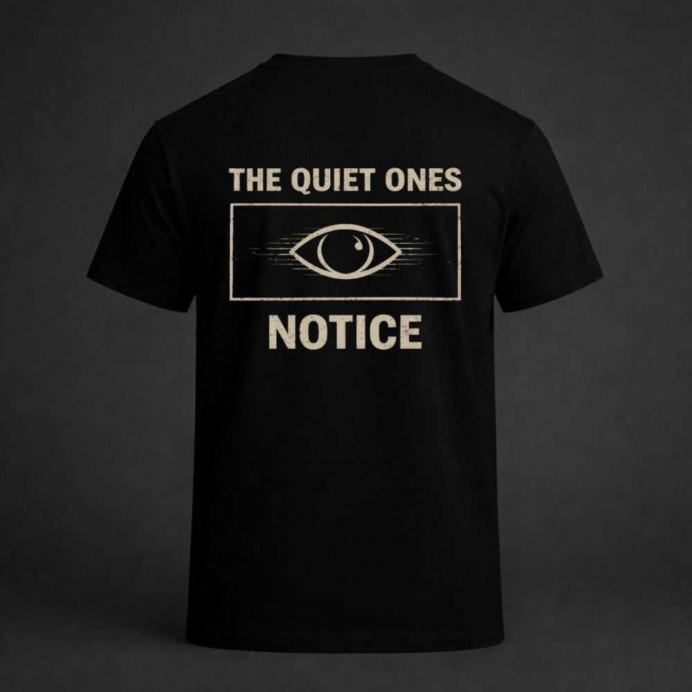 Black t-shirt with 'The Quiet Ones Notice' design on a dark background
