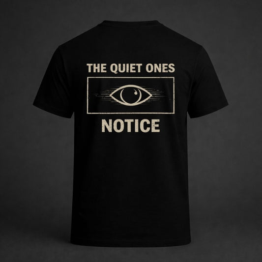 Black t-shirt with 'The Quiet Ones Notice' design on a dark background