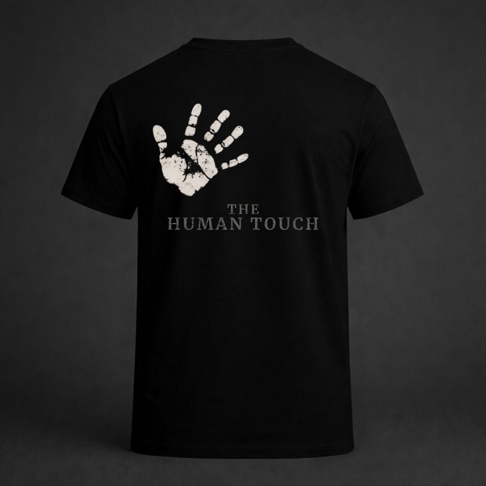 Black t-shirt with white handprint design and 'The Human Touch' text on a dark background