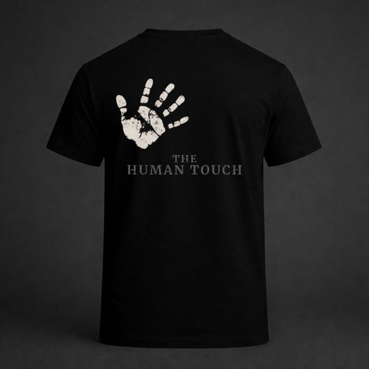 Black t-shirt with white handprint design and 'The Human Touch' text on a dark background
