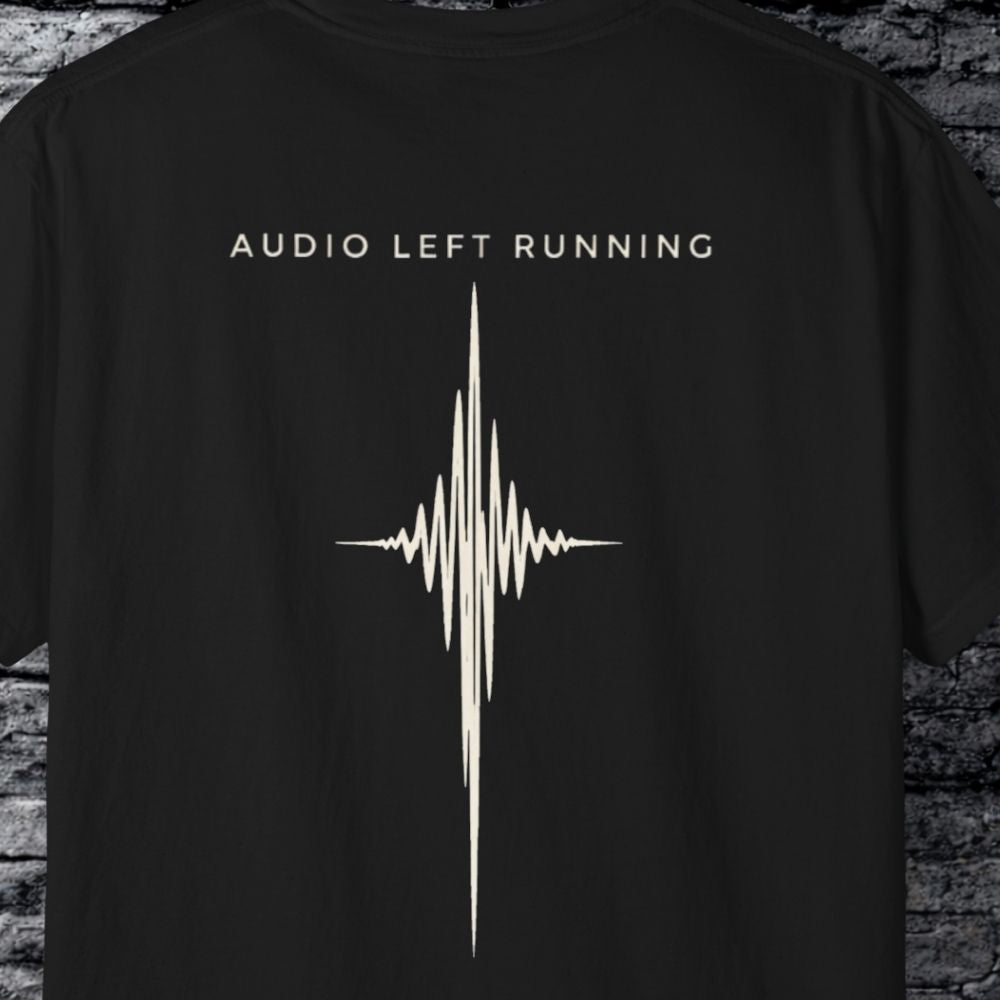 Close-up of minimalist bone waveform graphic on black streetwear tee