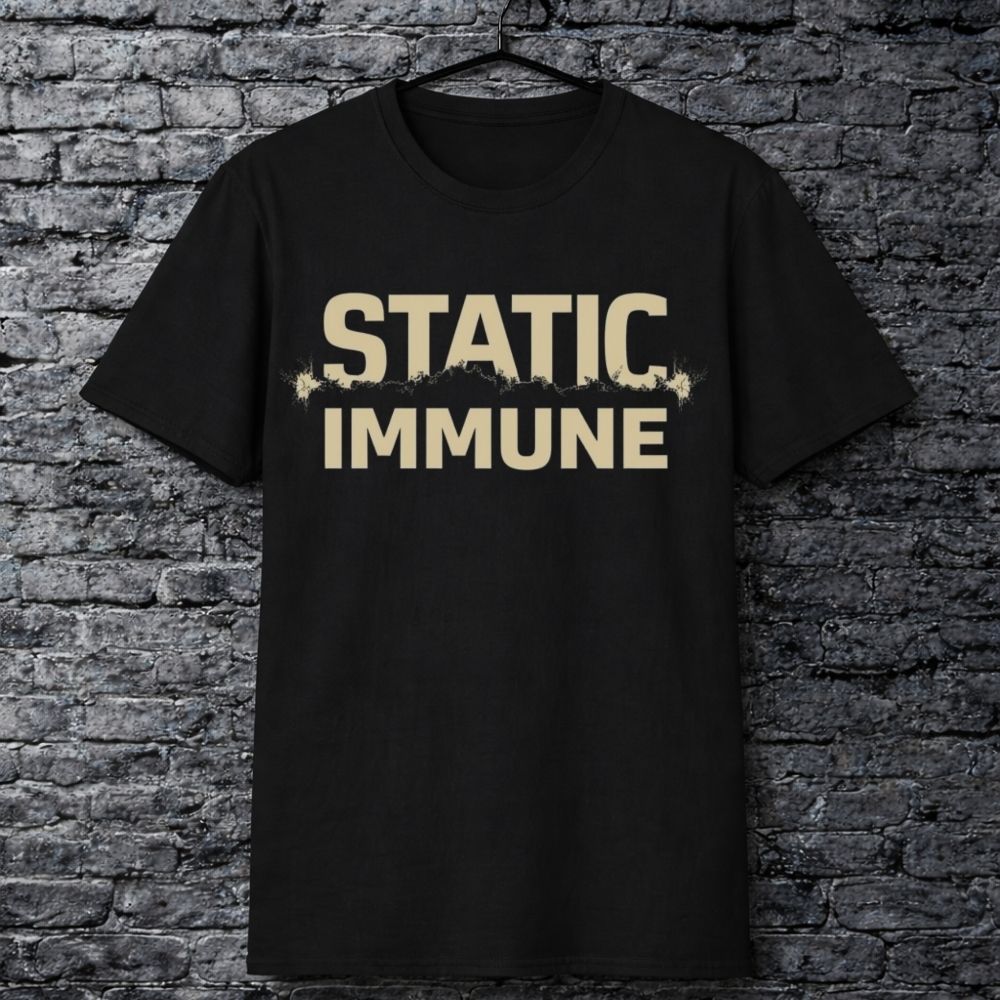 Black t-shirt with 'STATIC IMMUNE' text on a brick wall background