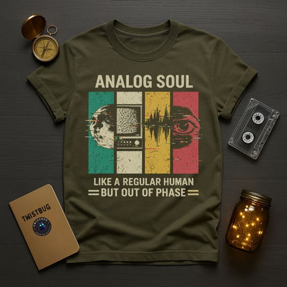 Green t-shirt with 'Analog Soul' design on a wooden surface with vintage items.