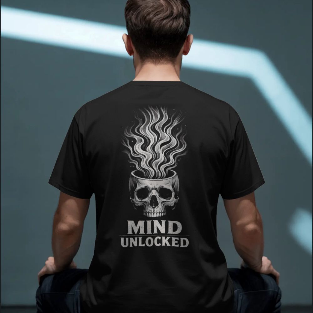 Person wearing a black t-shirt with a skull design and 'Mind Unlocked' text on the back.