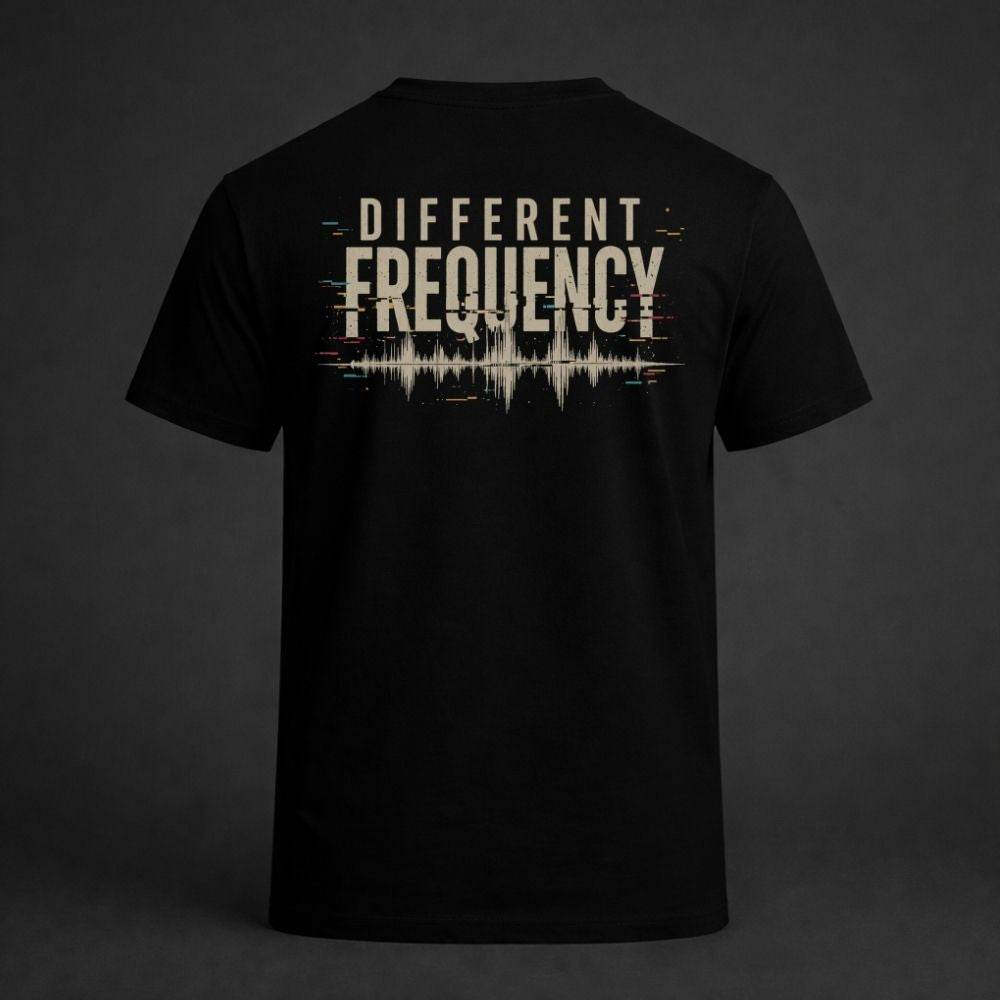 Black t-shirt with 'Different Frequency' design on a dark background