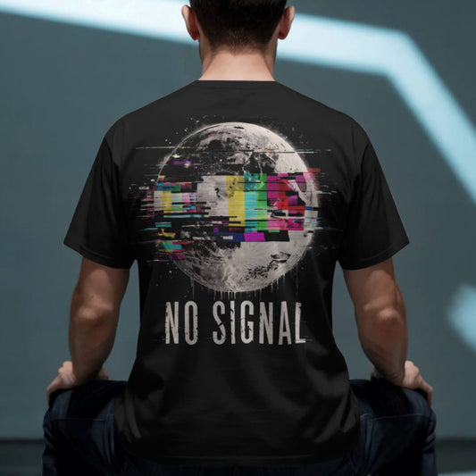 Person wearing a black t-shirt with 'NO SIGNAL' design on the back, sitting against a gray background.