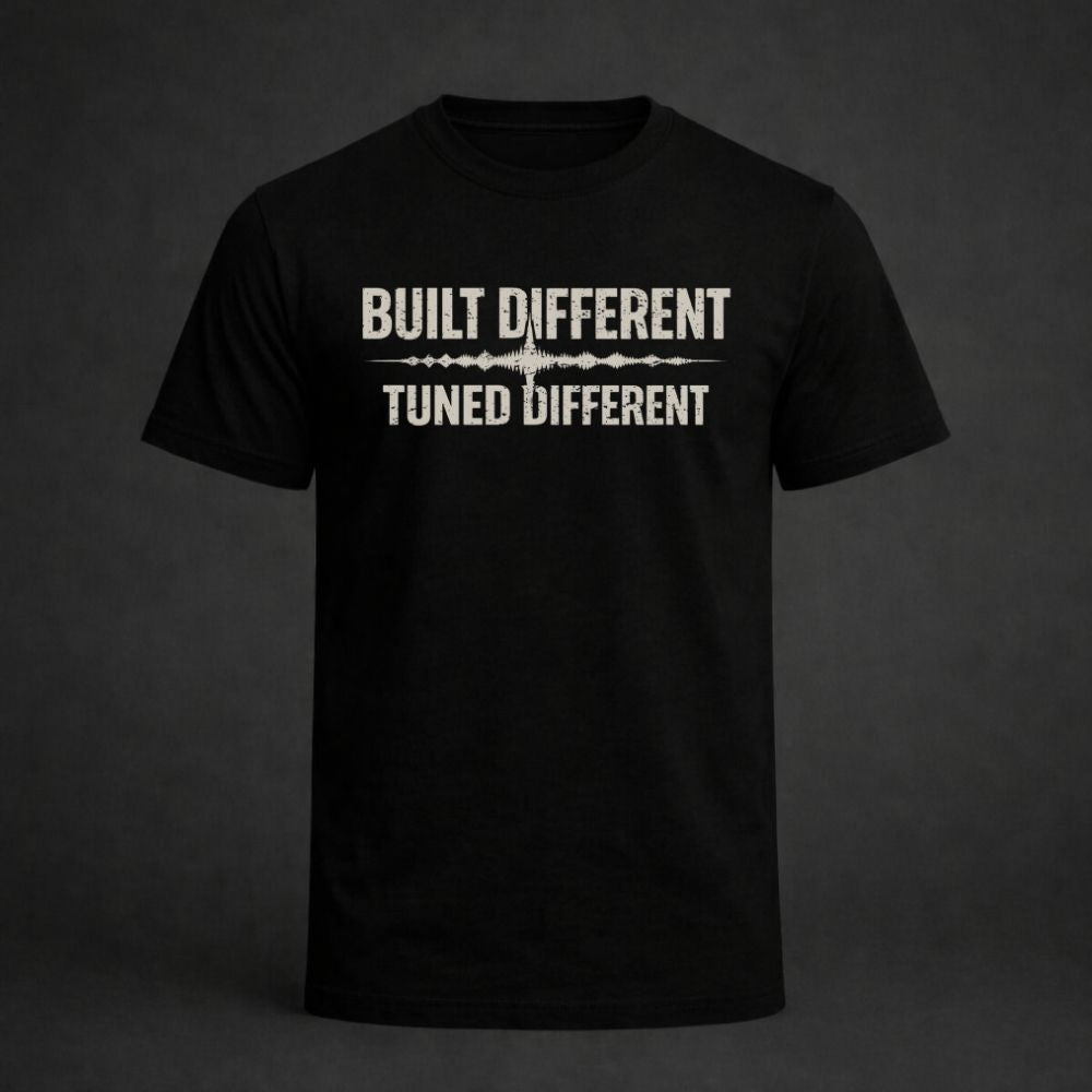 Black t-shirt with 'Built Different Tuned Different' text on a dark background