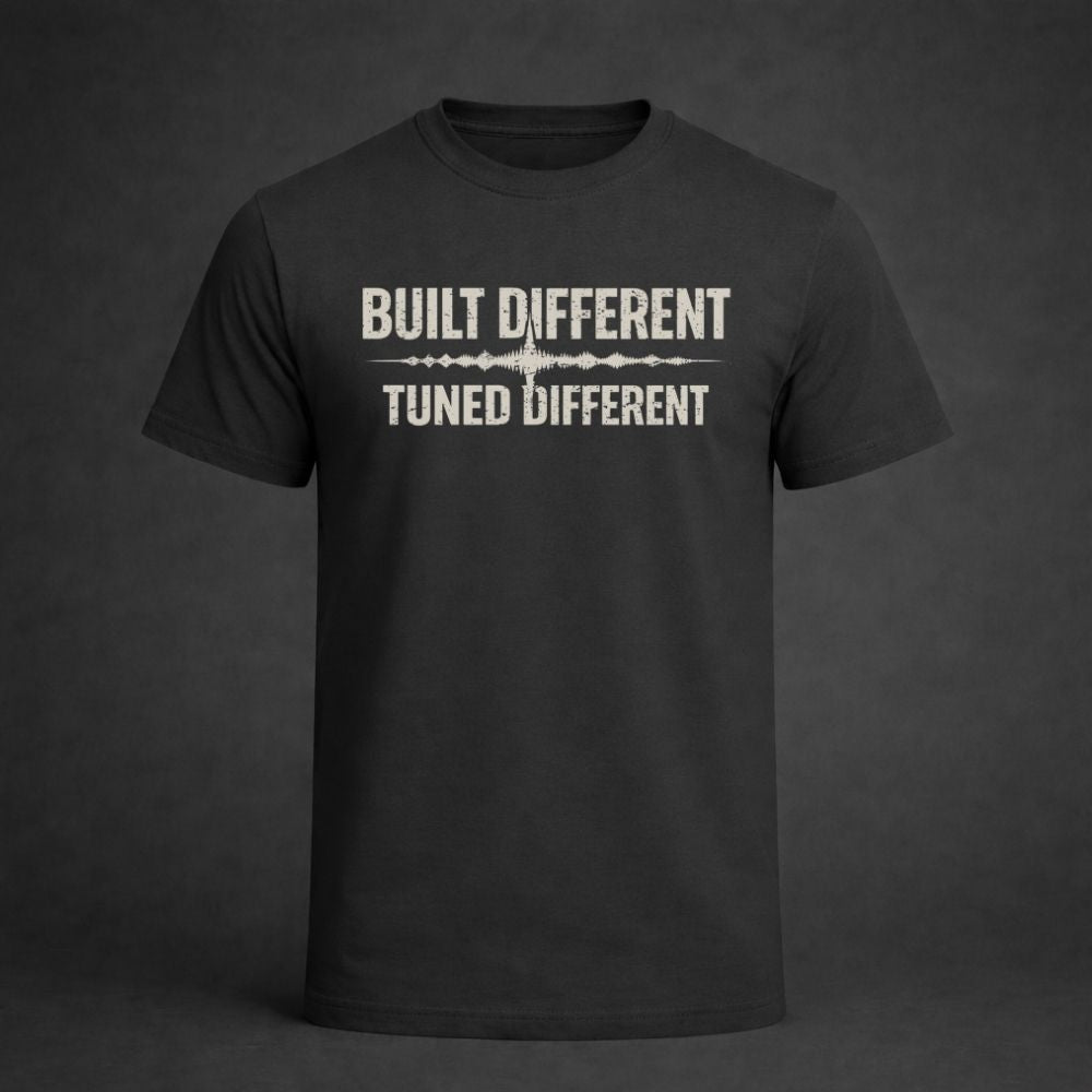 Black t-shirt with 'Built Different Tuned Different' text on a dark background