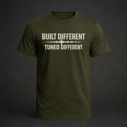 Green t-shirt with 'Built Different Tuned Different' text on a dark background