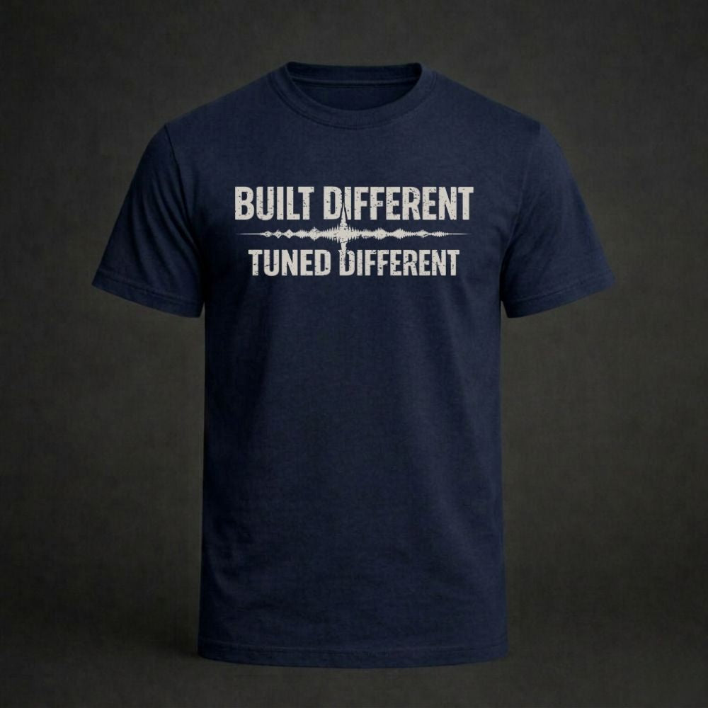 Navy blue t-shirt with 'Built Different Tuned Different' text on a dark background