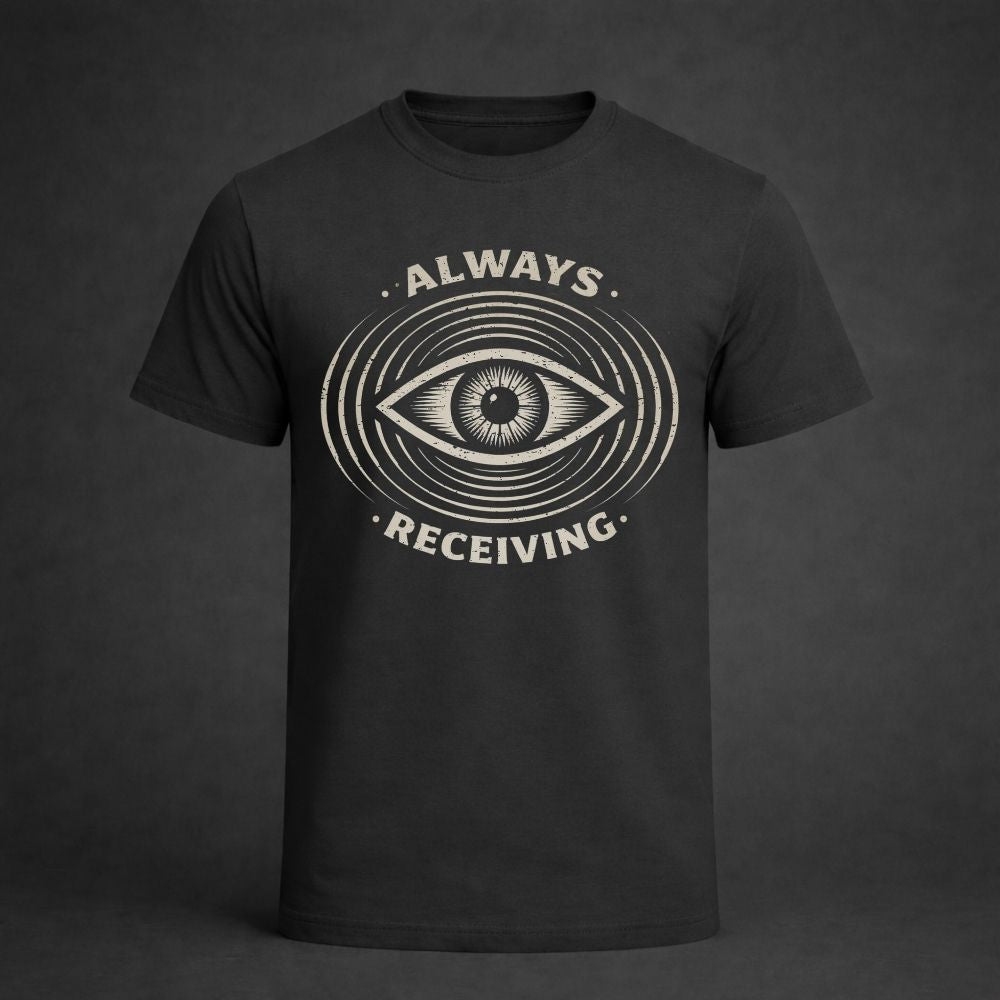 Black t-shirt with eye design and 'Always Receiving' text on a dark background