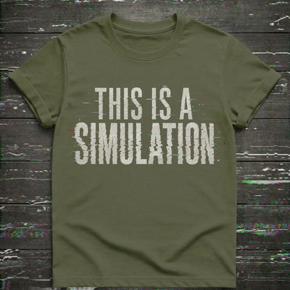 Green t-shirt with 'This is a Simulation' text on a wooden surface with digital noise.