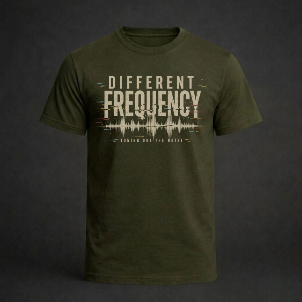 Green t-shirt with 'Different Frequency' text design on a dark background