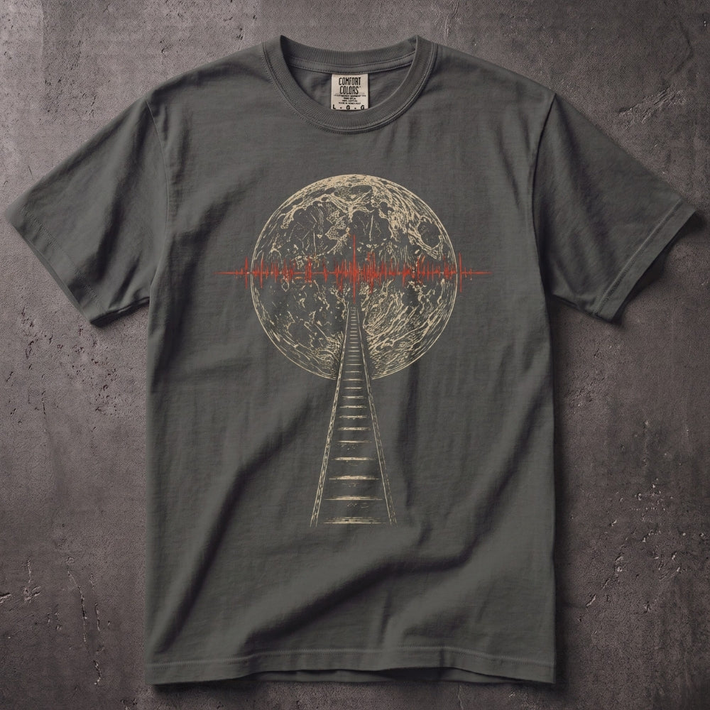 A dark gray crewneck t-shirt laid flat on a textured gray background. The shirt features a graphic print of a ladder leading up to a detailed moon, with a red soundwave line crossing the moon's horizon.