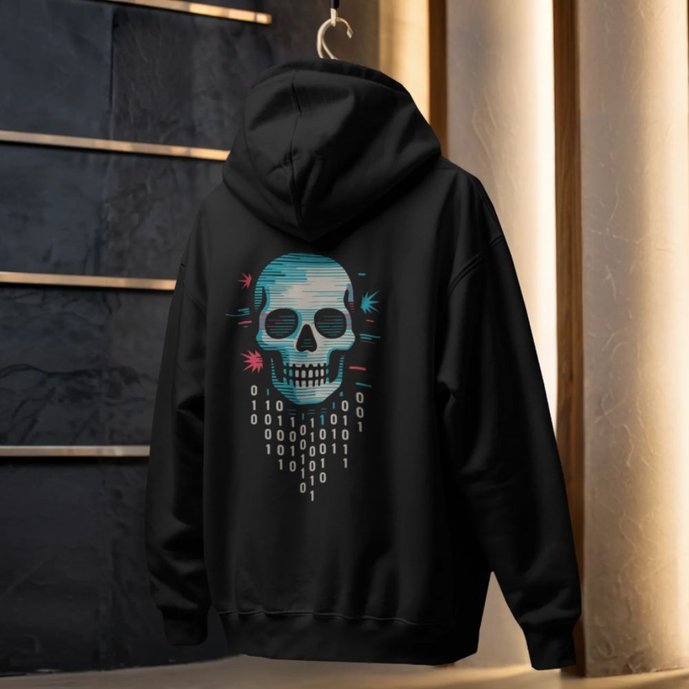 Black cyberpunk hoodie hanging in a studio setting, showing a glitch skull graphic with binary code on the back
