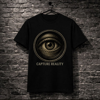 Black t-shirt with eye design and 'Capture Reality' text on a brick wall background