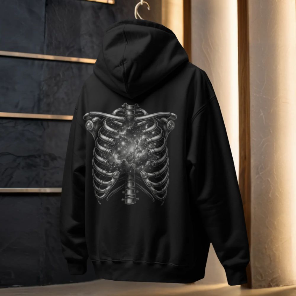 Black hoodie with a cosmic ribcage design on the back, revealing a glowing galaxy inside the chest, studio hanger mockup.