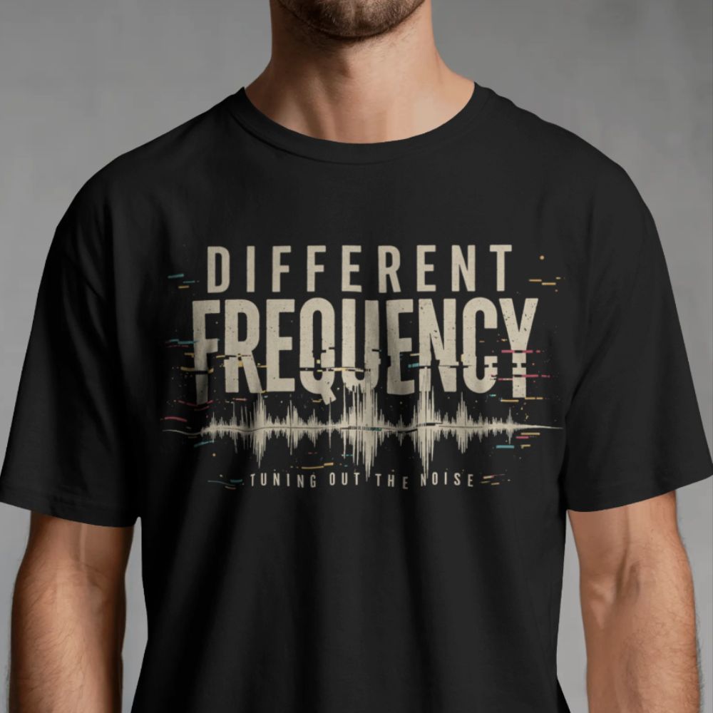 Black t-shirt with 'DIFFERENT FREQUENCY' design on a gray background