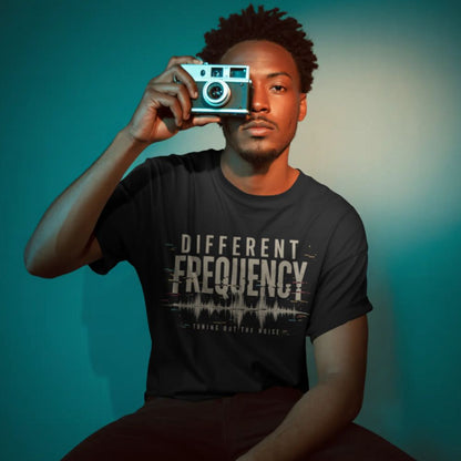 Person holding a camera with a gradient background