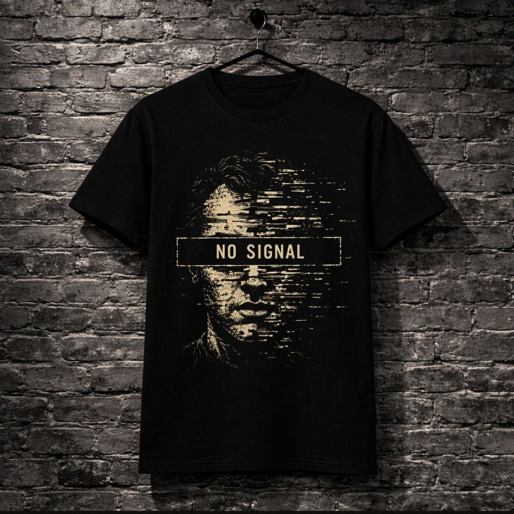 A black short-sleeve t-shirt hanging on a black hanger against a dark gray brick wall. The shirt features a distressed graphic of a face with horizontal pixelation and a central banner reading 'NO SIGNAL' in white.