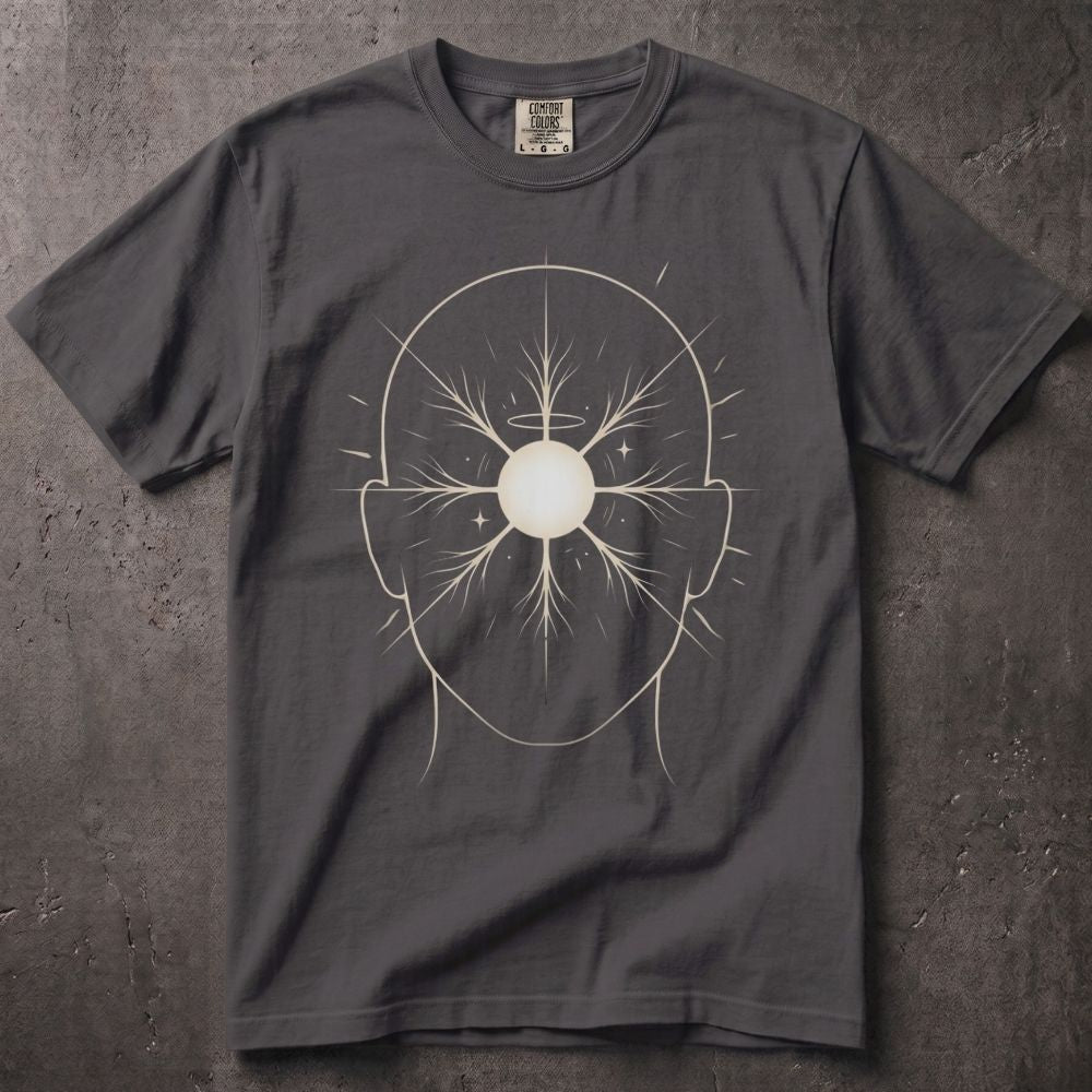 A dark gray crewneck t-shirt featuring a white line art graphic of a human head with a central sunburst design, laid flat on a textured gray background.