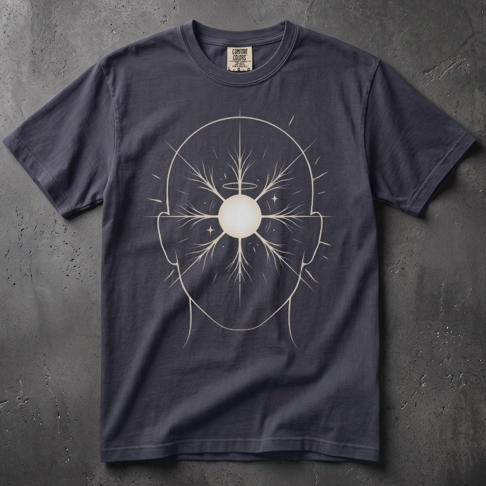 A dark navy blue crewneck t-shirt featuring a white line-art graphic of a human head with a glowing central orb, laid flat on a textured dark gray background.