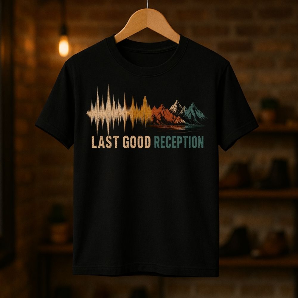 Black t-shirt with 'Last Good Reception' design on a wooden hanger against a dark background