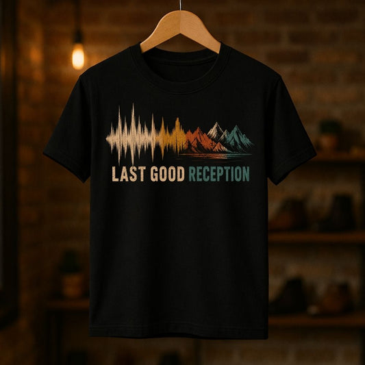 Black t-shirt with 'Last Good Reception' design on a wooden hanger against a dark background