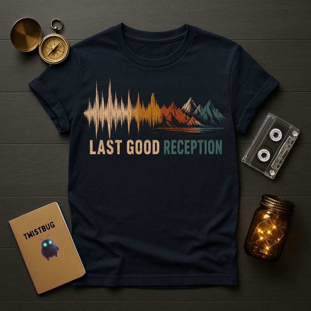 Navy blue t-shirt with 'Last Good Reception' design on a wooden surface with vintage items.