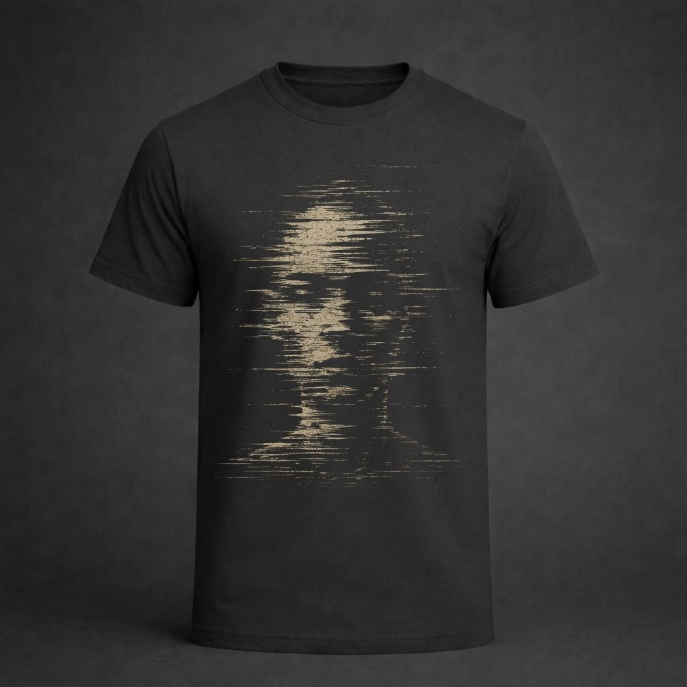 A dark charcoal gray short-sleeve t-shirt with a distressed, pixelated graphic of a face in light beige on the front, displayed against a dark gray background.