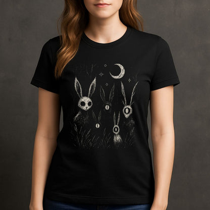 Female model wearing black surreal rabbit graphic T-shirt with moon and occult symbols