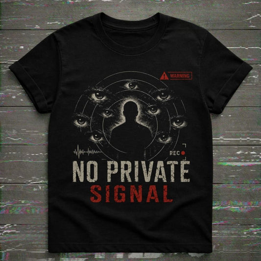 Black t-shirt with graphic design and text 'No Private Signal' on a wooden surface.