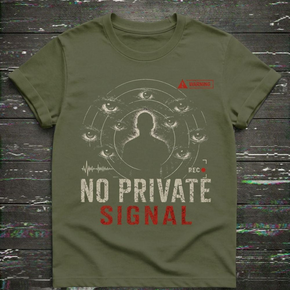 Green t-shirt with graphic design and text 'NO PRIVATE SIGNAL' on a wooden surface.