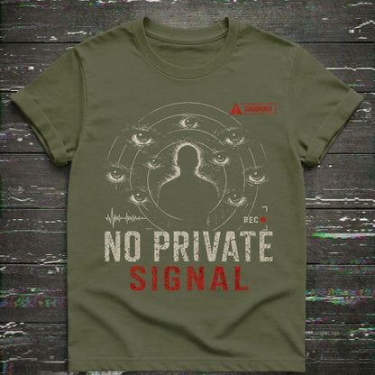Green t-shirt with graphic design and text 'NO PRIVATE SIGNAL' on a wooden surface.