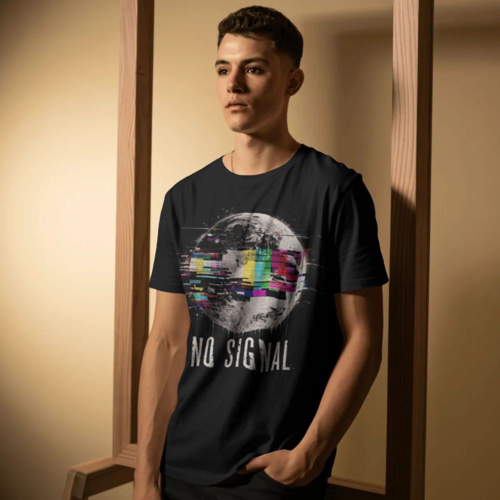 Person wearing a black t-shirt with 'No Signal' graphic design in a room.