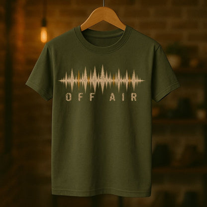 Green t-shirt with 'OFF AIR' graphic design on a wooden hanger against a blurred background