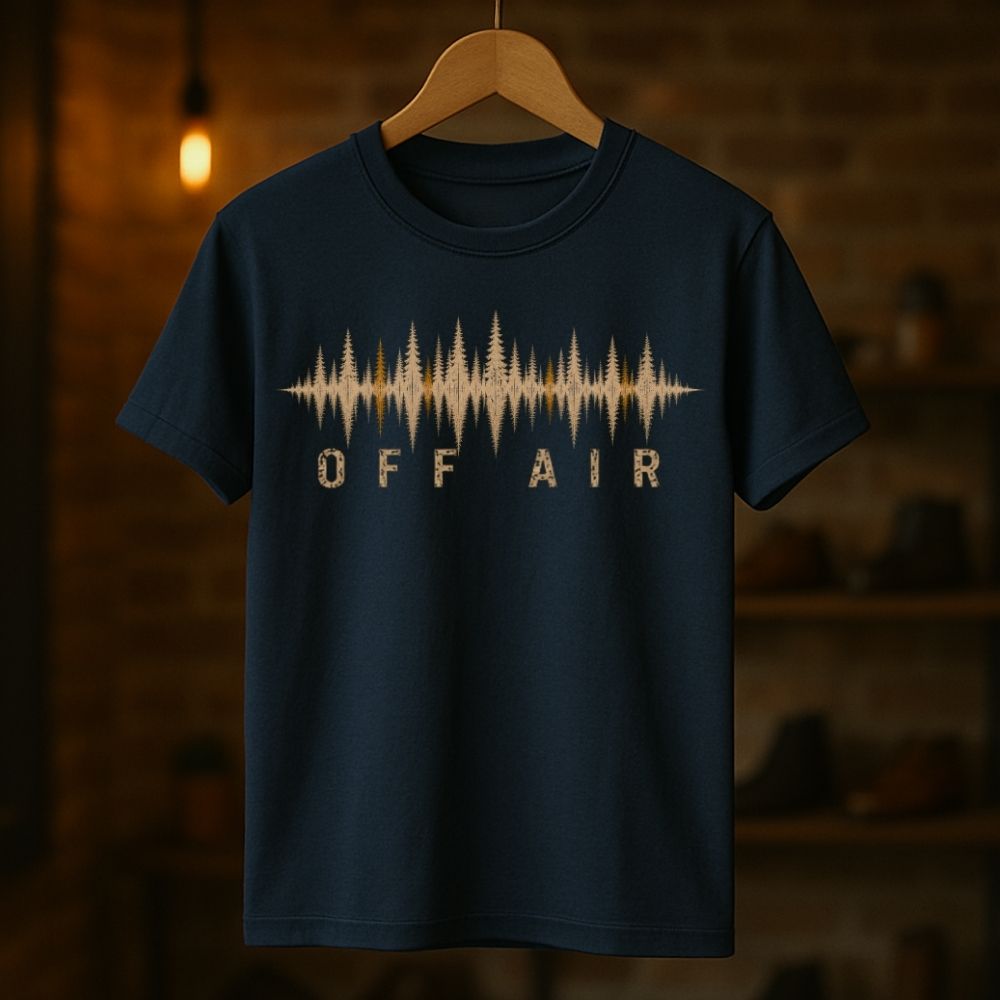 Navy blue t-shirt with 'OFF AIR' graphic on a wooden hanger against a dark background
