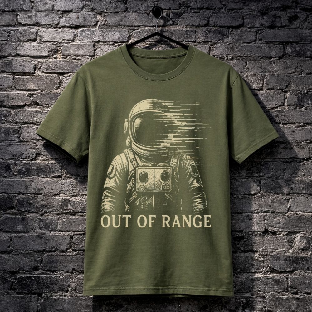 Green t-shirt with an astronaut graphic and 'Out of Range' text on a brick wall background