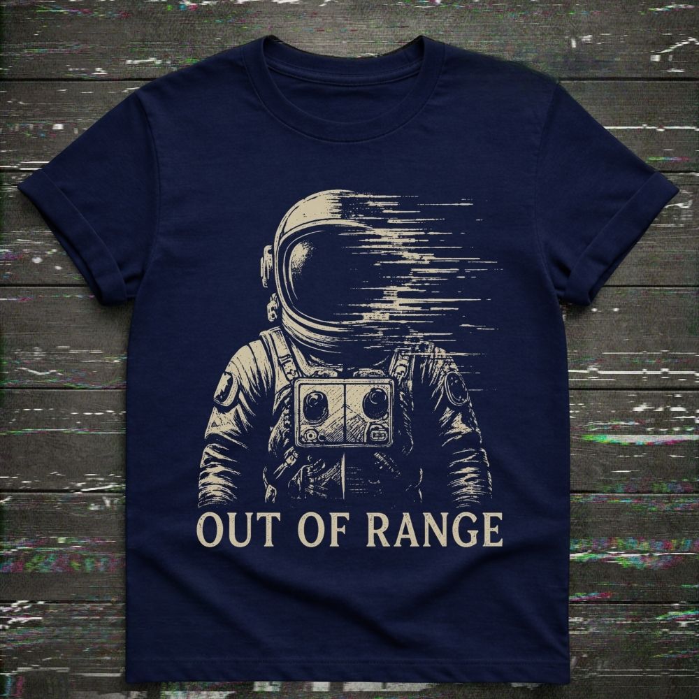 Navy blue t-shirt with an astronaut graphic and 'Out of Range' text on a wooden surface.