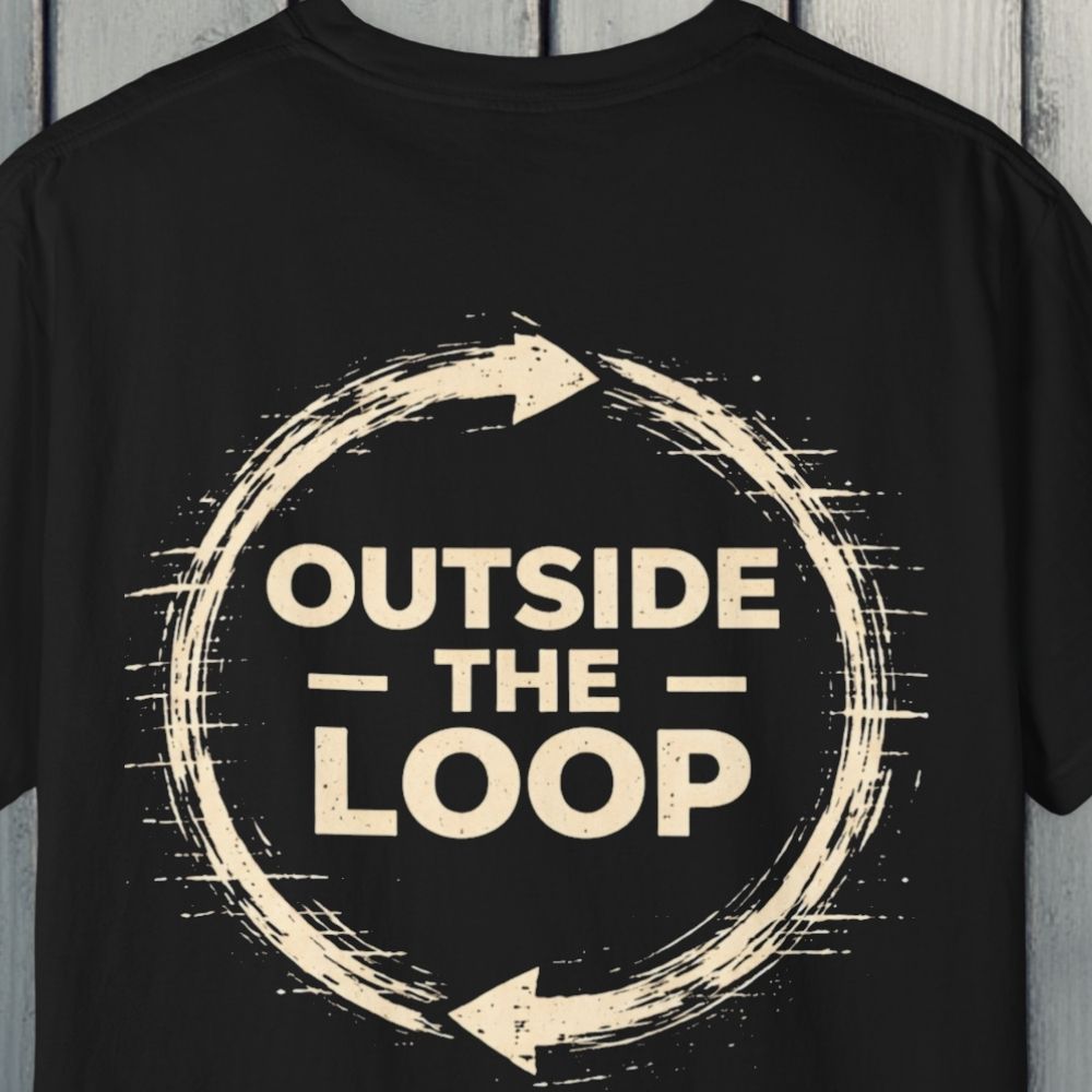 Black t-shirt with 'Outside the Loop' design on a wooden background