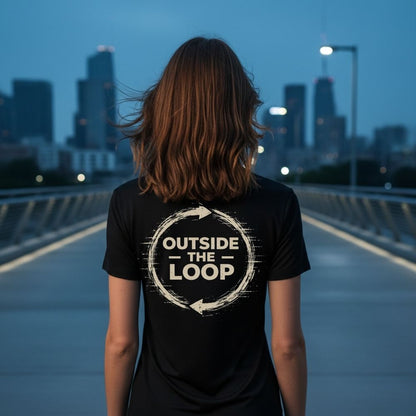 Person wearing a black t-shirt with 'Outside the Loop' design on a cityscape background