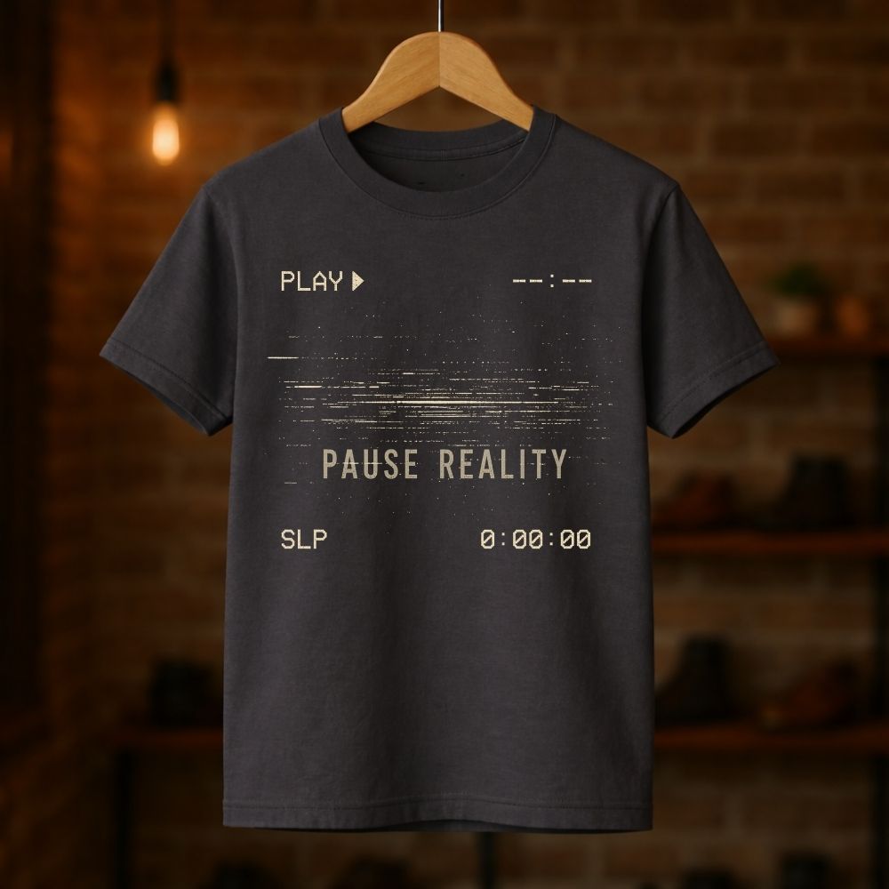 Black t-shirt with text design on a wooden hanger against a blurred brick wall background