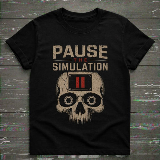 Black t-shirt with skull design and 'Pause the Simulation' text on a wooden surface.