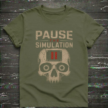 Green t-shirt with 'Pause the Simulation' graphic design on a wooden surface