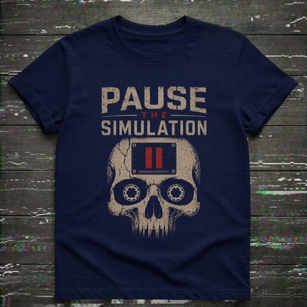 Navy blue t-shirt with skull design and 'Pause the Simulation' text on a wooden background