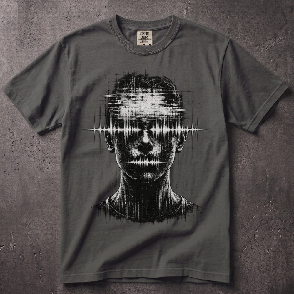 A dark gray crewneck t-shirt featuring a black and white graphic of a human face with a soundwave pattern across the eyes, laid flat on a textured gray background.