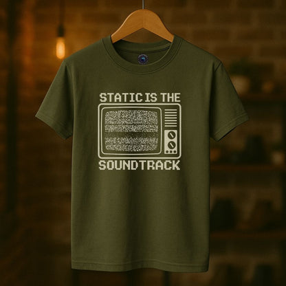 Green graphic T-shirt flat lay with analog TV static artwork